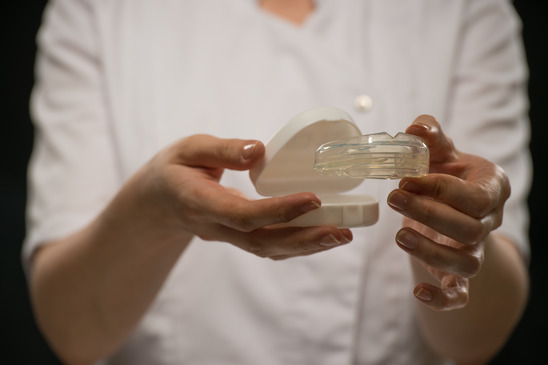 Dentist Showing Mouthguard